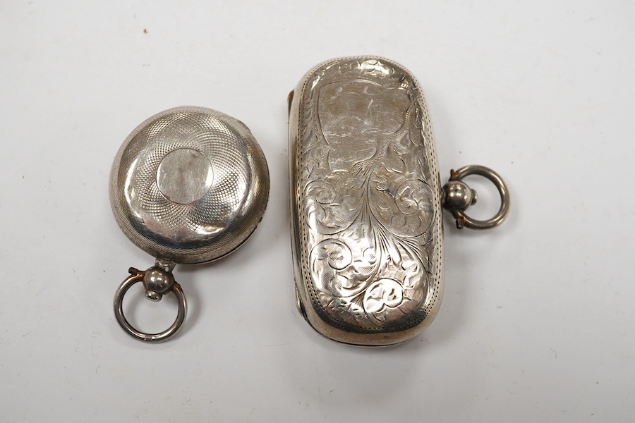 An Edwardian silver combination stamp/sovereign case, marks rubbed, Chester, 1909, 57mm and a similar sovereign case, marks rubbed, Chester, 1901. Condition - poor